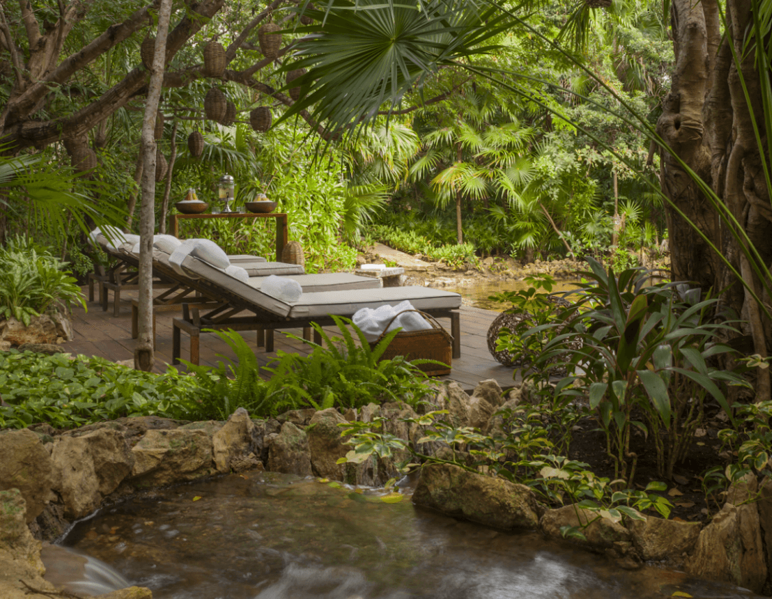 two canal-side lounges overlook water at mayakoba spa